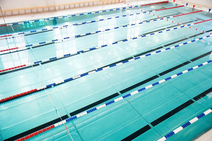 indoor pool with lanes for aquatic activities